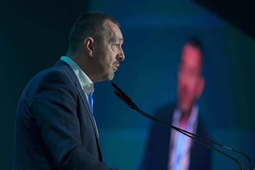 Chris Boardman speaks at a lectern during COP29 in Azerbaijan.