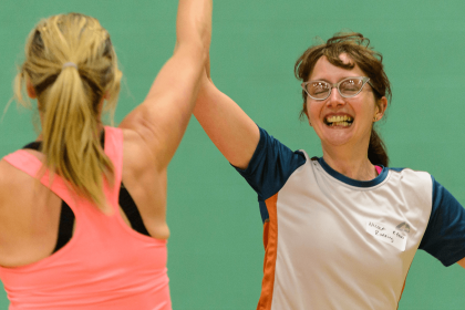 Two women high fiving during game